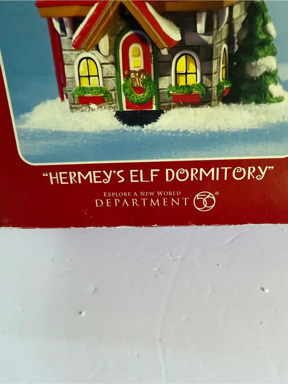 Department 56 Rudolph Hermey's Elf Dormitory - Red, Green, White, Gold